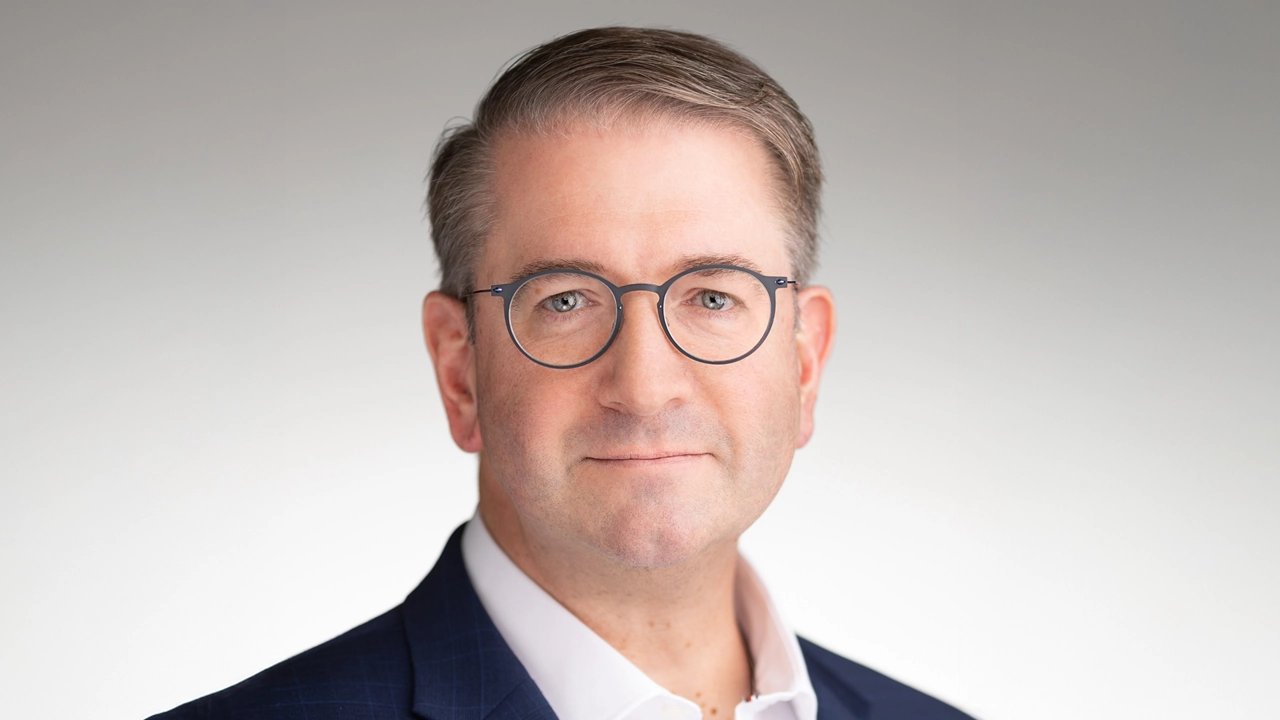 Chris Shelton, Senior Vice President, Chief Product Officer and President, AES Next, of the energy company AES Corporation, shares his insights in a conversation led by Adam Bryant and David Reimer. The discussion highlights the importance of adopting AI through clear constraints, integrating AI into transformation processes, and leveraging AI for innovation. Shelton emphasizes cultural initiatives, the role of transformation offices, and embedding AI in strategic thinking as key components.